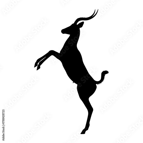 Silhouette of a gazelle rearing up on hind legs antelope