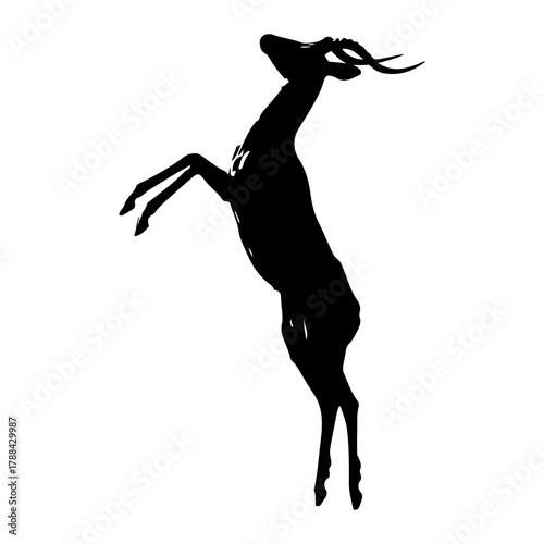 Silhouette of an antelope leaping with legs extended