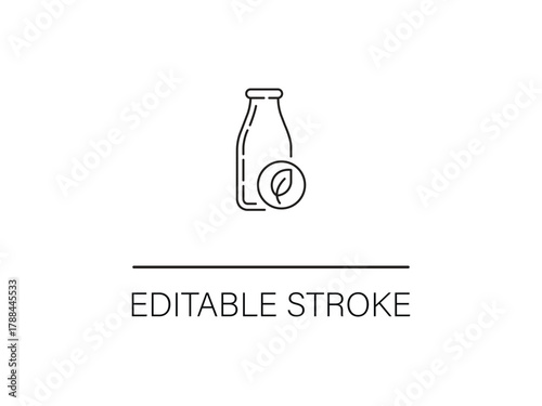 Fresh organic milk in a minimalist bottle with a leaf for healthy breakfast recipes and eco eco-friendly lifestyle brands, and sustainable products.