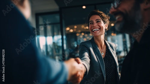 Businesspeople shaking hands with smiles agreement and deal concept