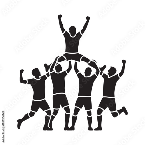 Cheerleaders form a human pyramid celebrating victory