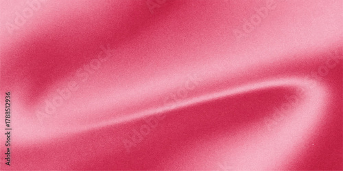 Soft pink satin silk fabric forms a flowing, luxurious textile texture and backdrop