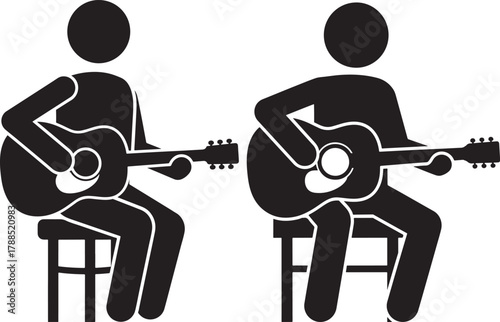Two people sitting and playing acoustic guitars silhouette