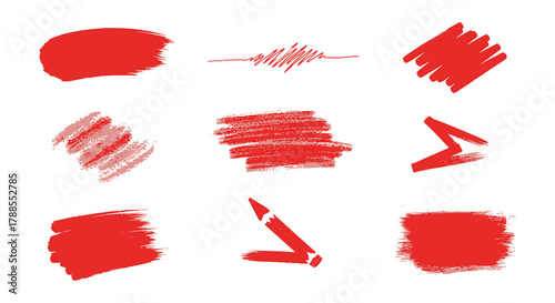 Collection of nine abstract red brush stroke and paint splash elements on a white background
