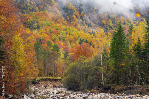 Beautiful and foggy valley in autumn in Ordesa National Park Pyrenees, Huesca Aragon Spain