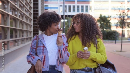 African american female friends eating ice cream
