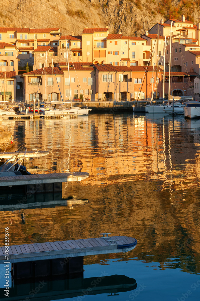 Fototapeta premium Portopiccolo seaside resort and marina during an autumn sunset, on the Trieste coast, Italy