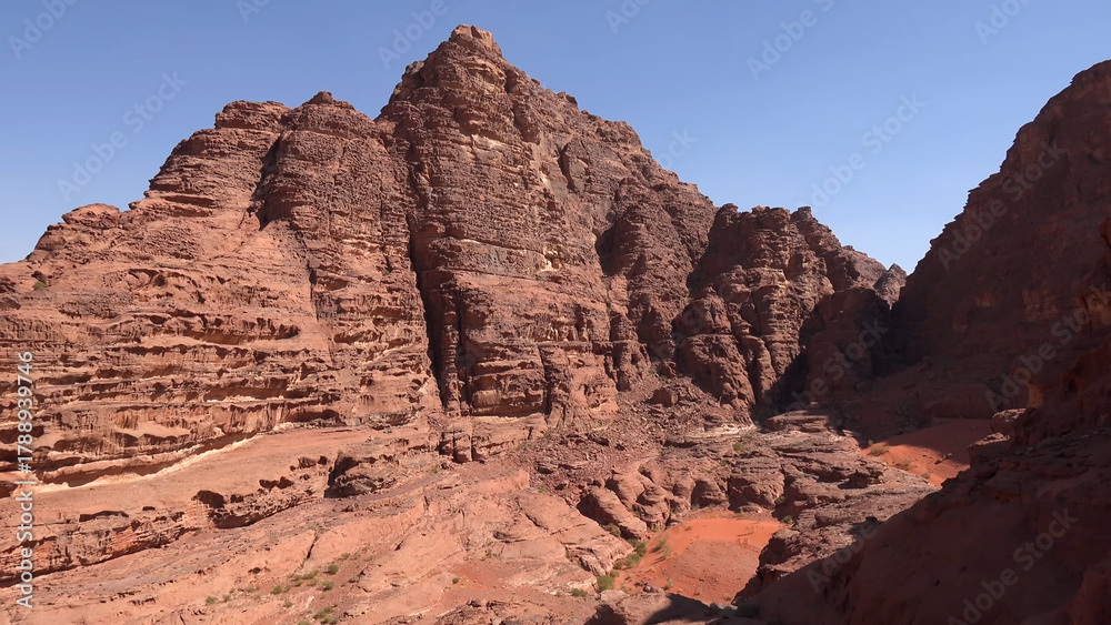 Fototapeta premium A trip to Wadi Rum desert in Jordan. Beautiful african travel photo. Mountains, rocks, canyon, nature. Summer vacation in arab country. Moon Valley. Martian desert.