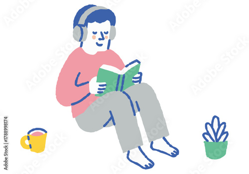 Man reading with headphones on