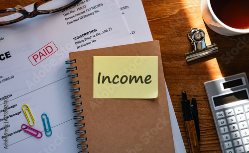 There is sticky note with the word Income. It is as an eye-catching image.