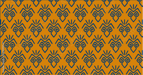 Orange geometric pattern inspired by traditional motifs with symmetrical repeating shapes.