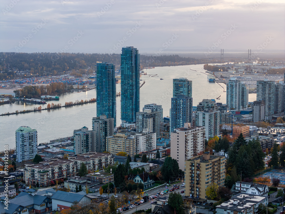 Fototapeta premium New Westminster Skyline Over The Fraser River With Tall Blue Towers And Waterfront View
