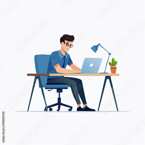 Man working on laptop at desk with focused concentration.