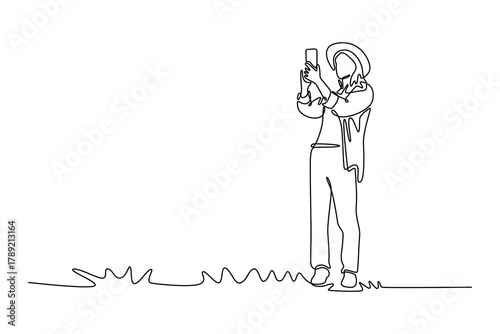 Woman tourist capturing photos of an ancient fortress for a travel blog. Travel experience concept. Single line draw design. Vector graphic illustration