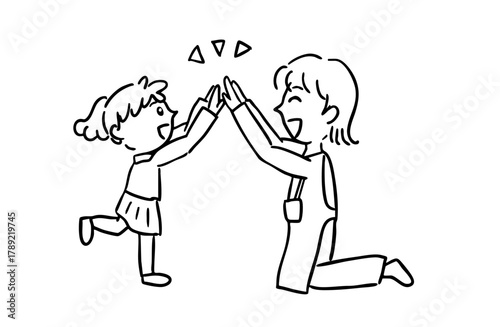 モノクロ・ハイタッチをする子どもと先生