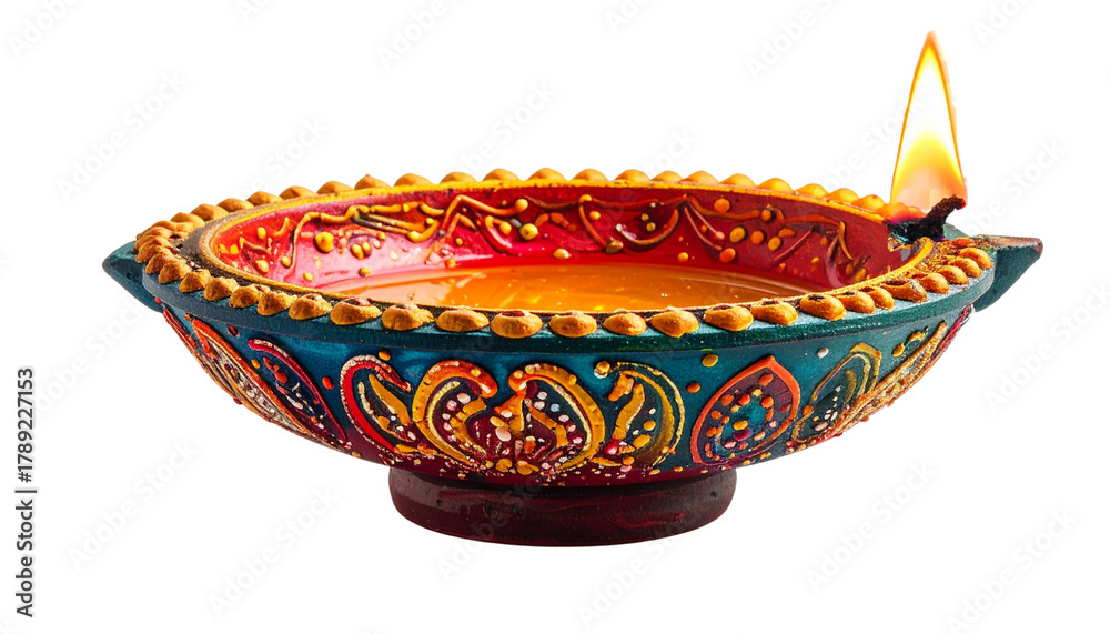 Fototapeta premium Beautifully Hand-Painted Clay Diya Oil Lamp with Burning Flame Isolated