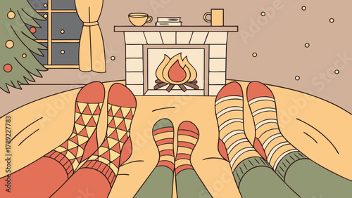 Cozy christmas scene with feet in socks by the fireplace and christmas tree in the background