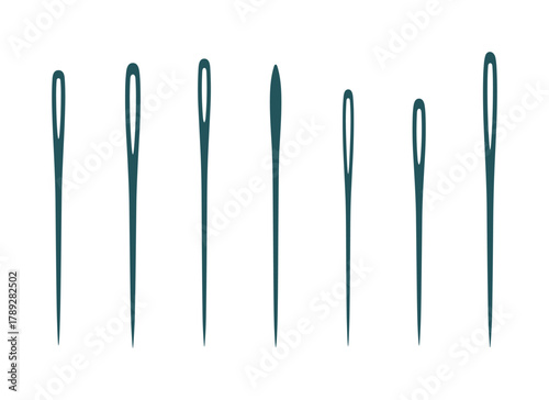 Collection of various sewing needles in different sizes for tailor work on white background