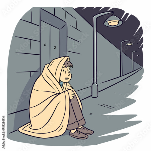 A homeless person sits on the street wrapped in a blanket on a cold night
