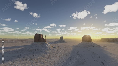 Sunset aerial view of the snow on Sandstone Buttes in Monument Valley Navajo Tribal Park on the Colorado Plateau. Arizona. United States