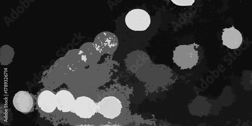 Abstract grayscale bokeh lights and textures on a dark background creating a moody atmosphere