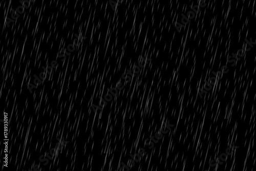 Heavy rain effect falling against a dark black background, a realistic and moody seamless loop overlay for dramatic weather visuals, stormy atmosphere, or environmental backdrop.