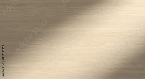 Soft shadow cast on a textured beige surface, creating a gradient of light and shade.