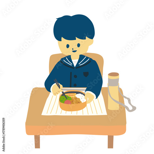 お弁当を食べる園児男子