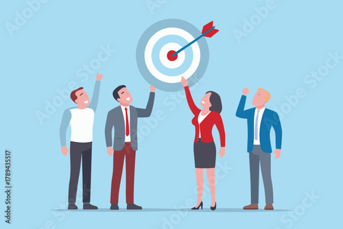 Diverse business team celebrating hitting their target with an arrow in the bullseye of a dartboard