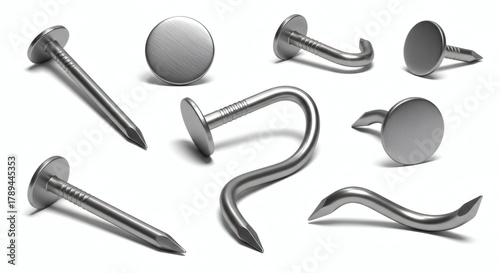 Various metal nails and hooks arranged against a white background, isolated and detailed