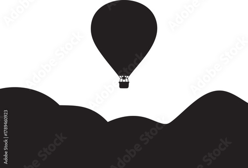 Silhouette of hot air balloon floats above undulating hills against white background