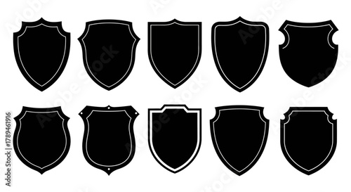 Collection of ten diverse black shield shapes and silhouettes on a white background