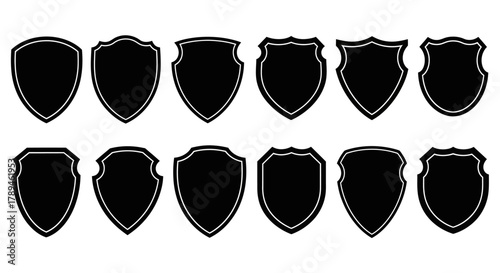 Collection of black shield silhouettes isolated on white background for design elements