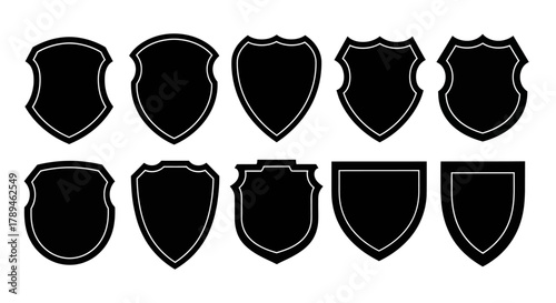 Collection of ten different black shield shapes and crests on a white background