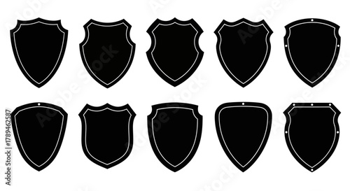 Collection of ten diverse black shield silhouettes with decorative borders on a white background