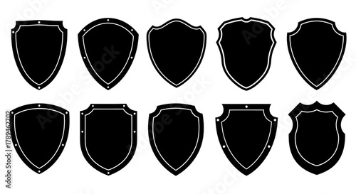 Collection of ten diverse black shield emblems and crests on a white background