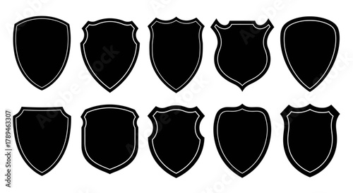 Collection of ten different black shield silhouettes isolated on white background