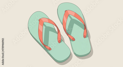 Two green and coral flip-flops rest on a light beige surface, ready for summer.