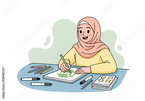 A young woman wearing a hijab is drawing on a sketchbook with colored pencils on a table.
