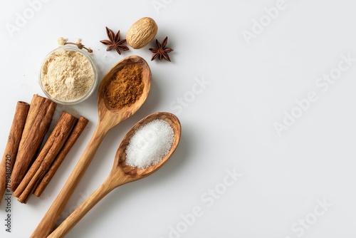 Baking Ingredients Displayed Using Wooden Spoon and Cinnamon Spices
