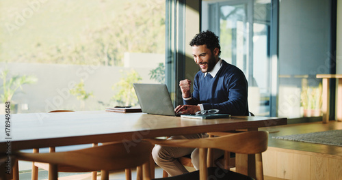 Happy, businessman and accountant winning with laptop, fist pump or good news for promotion. Excited, man or smile with celebration, computer or success for bonus or salary increase in workplace