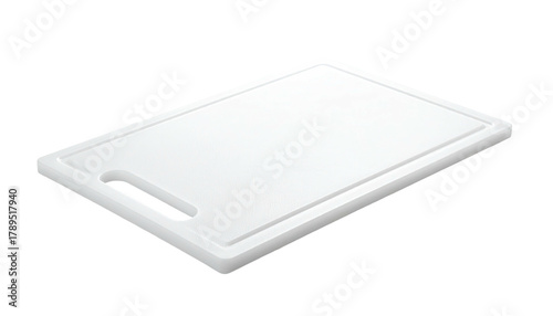 Rectangular, white cutting board shown at an angle on black