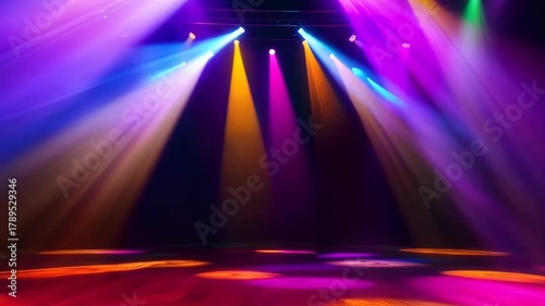 Dynamic Colorful Stage Lights Illuminating A Dark Venue With Vibrant Beams Of Yellow Orange Pink Purple Blue And Green Light Creating An