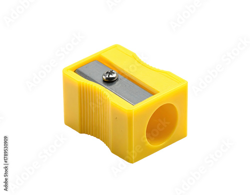 Yellow pencil sharpener with gray blade on black background
