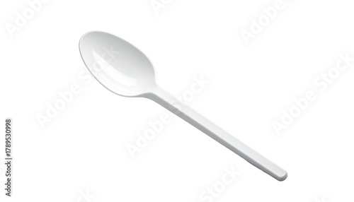 White plastic spoon isolated on dark