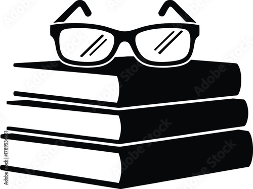 Stack of books with eyeglasses on top