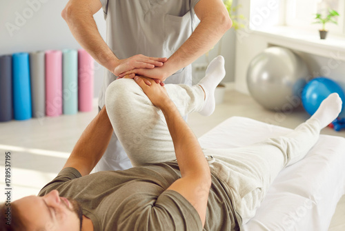 Obraz na plátne Rehabilitation knee, leg massage, corrective exercise reducing pain, sport injury, joint health, fix muscle imbalance