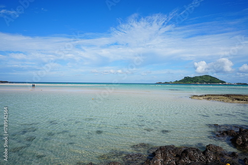clear shoaling beach and people