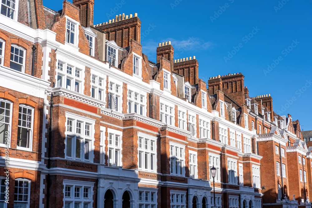Fototapeta premium Traditional british detached houses with red bricks seen in Chelsea, London