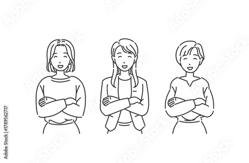 オフィスカジュアル女性 腕組みで笑顔 モノクロスタイル